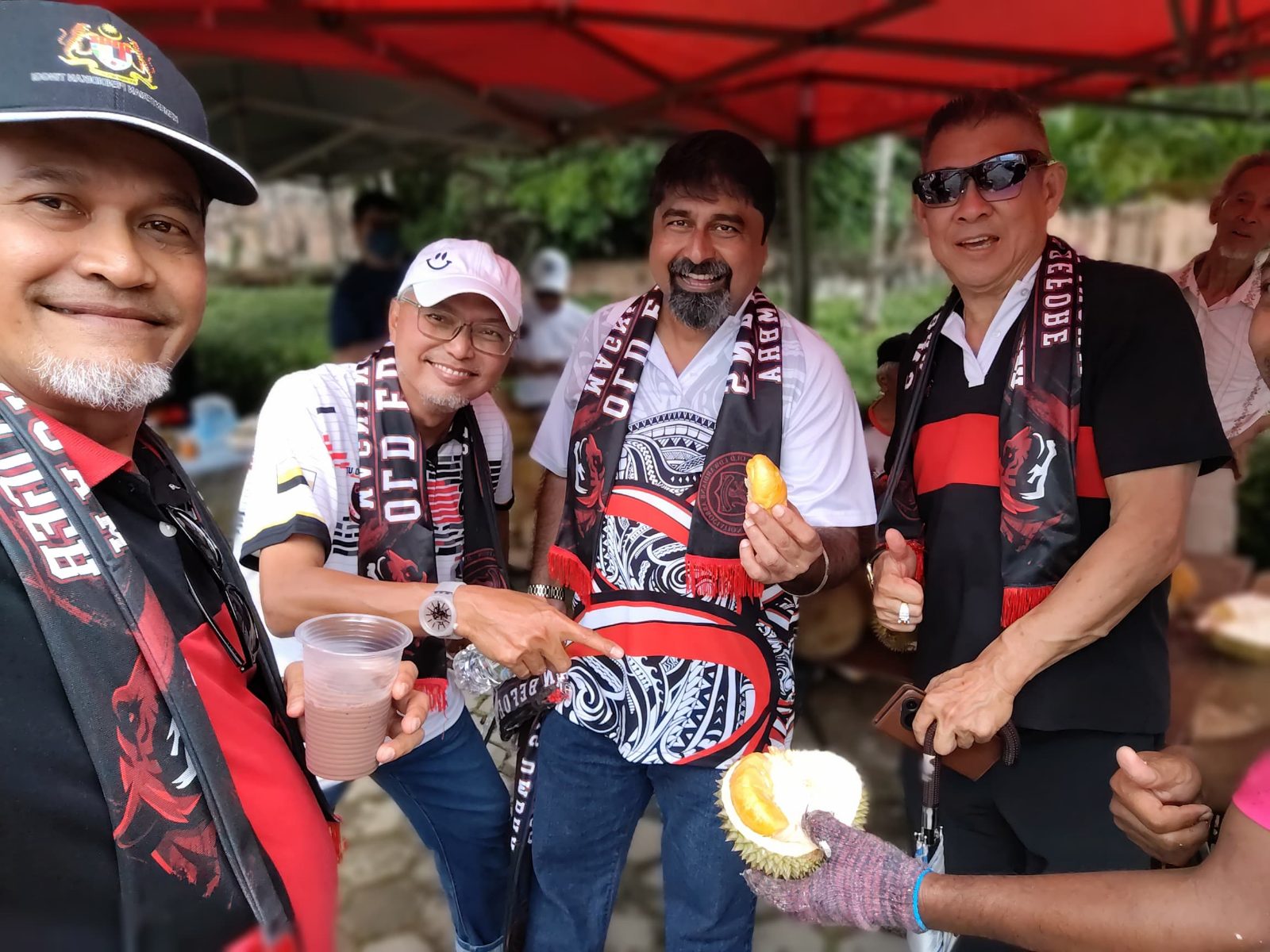 Old Edwardians sharing durian at Stadium Merdeka